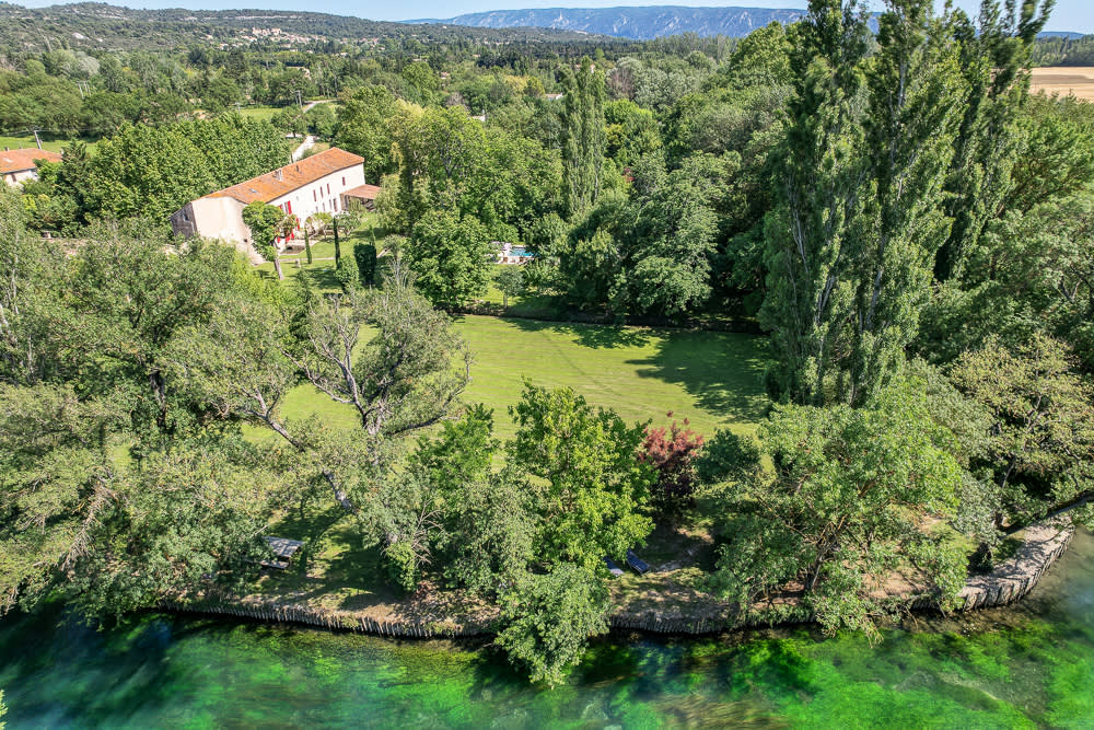 The estate from the air: house, parkland and the river running past it