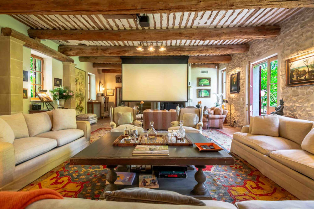 The second sitting room, with sofas and a projection screen