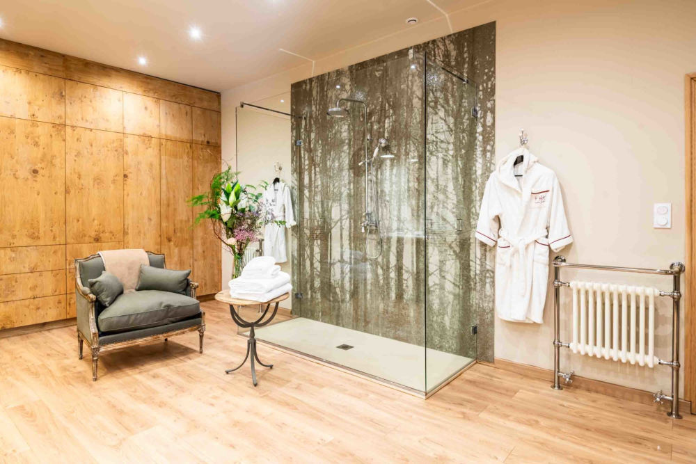 A large ensuite with a walk-in rain shower